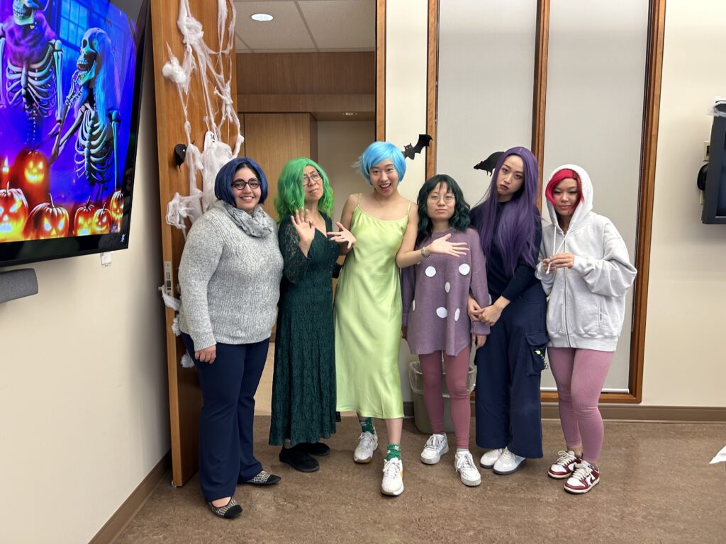 A group poses with halloween costumes inspired by the movie Inside Out 2